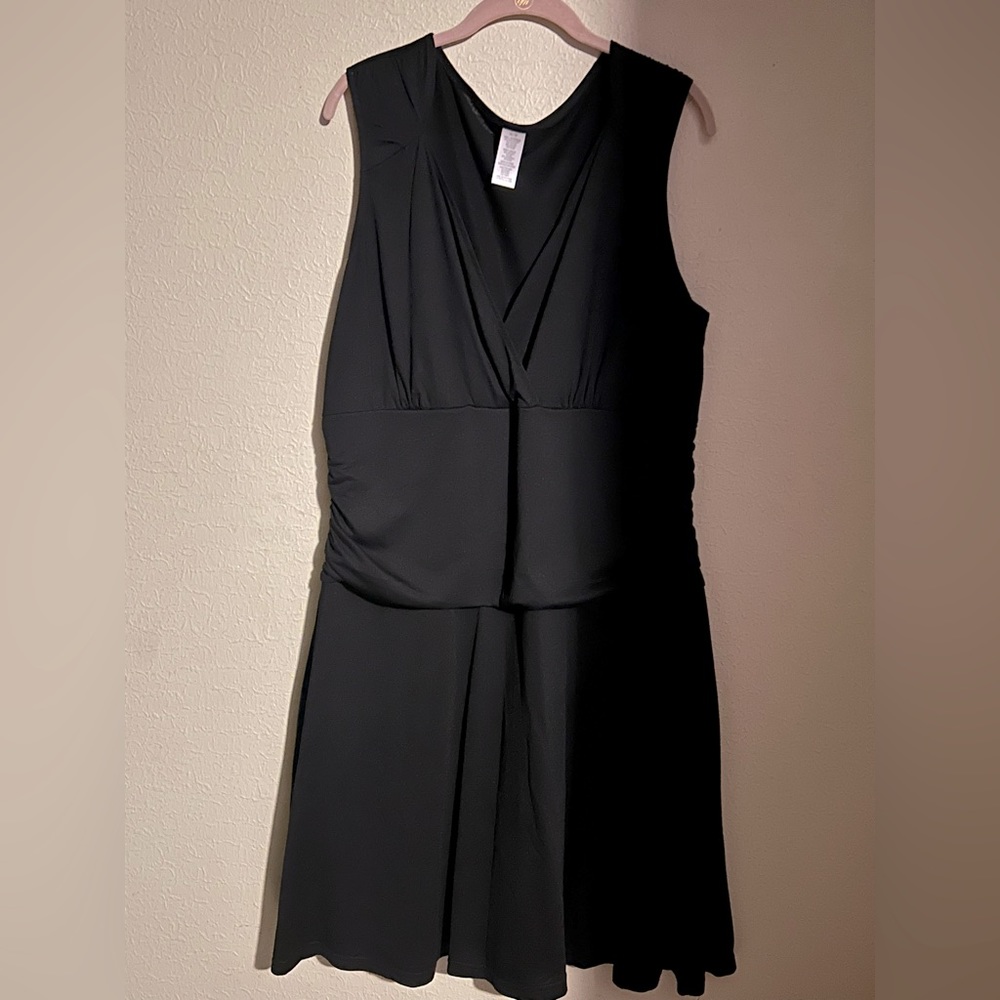 Avon- Black sleeveless dress with shape wear in the middle.